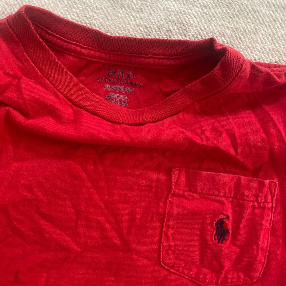 Total of 10 boys shirts. Under armour, Calvin Klein, Polo by Raulph Lauren.